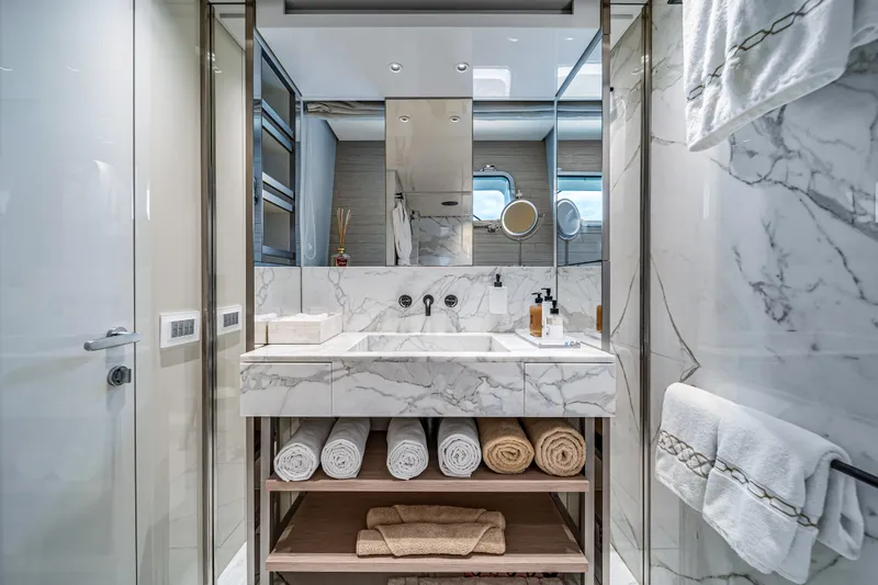 Mave Yacht Photos Pics Luxurious marble bathroom on 2020 Sanlorenzo SX88 yacht with elegant fixtures and plush towels.