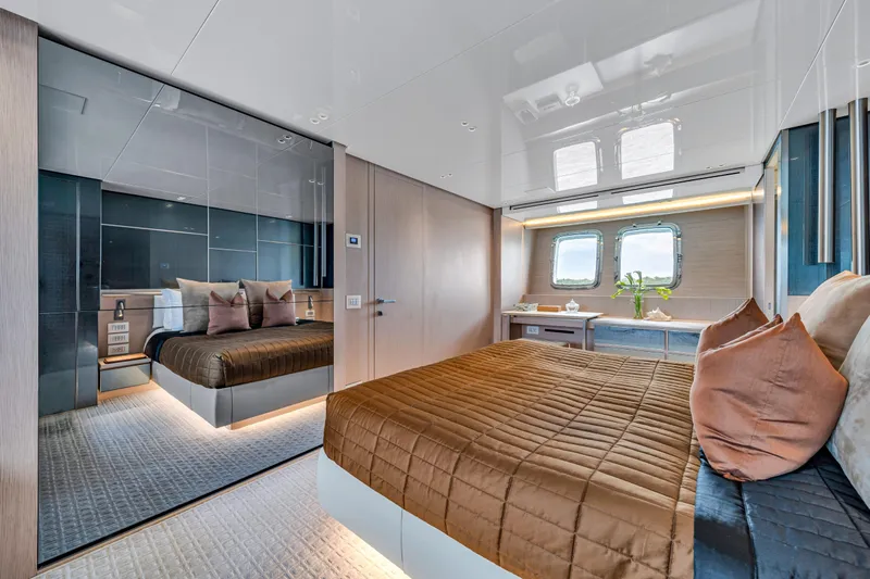 Mave Yacht Photos Pics Luxurious Sanlorenzo SX88 2020 yacht bedroom with elegant decor and large windows.