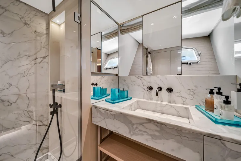 Mave Yacht Photos Pics Luxurious marble bathroom in 2020 Sanlorenzo SX88 yacht with modern fixtures and elegant design.