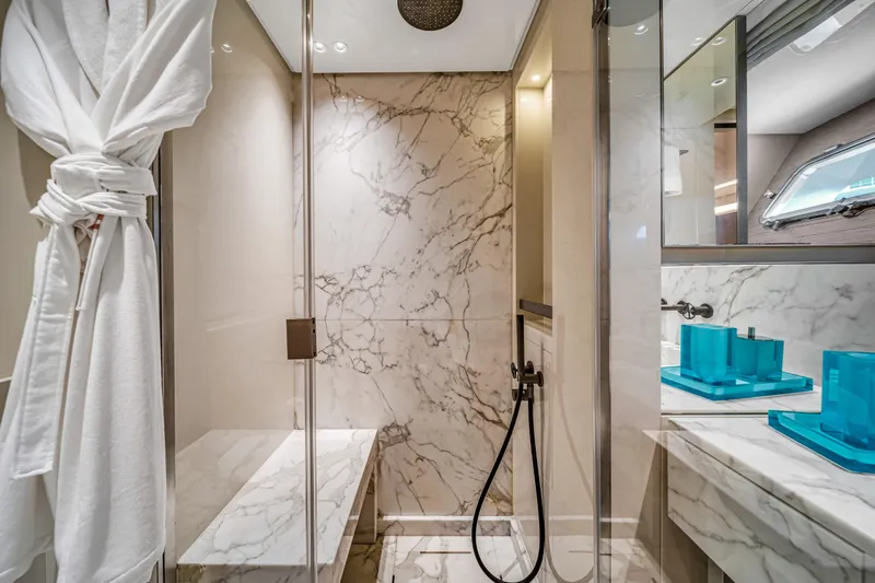 Mave Yacht Photos Pics Luxurious marble bathroom in 2020 Sanlorenzo SX88 yacht, featuring modern fixtures and elegant design.