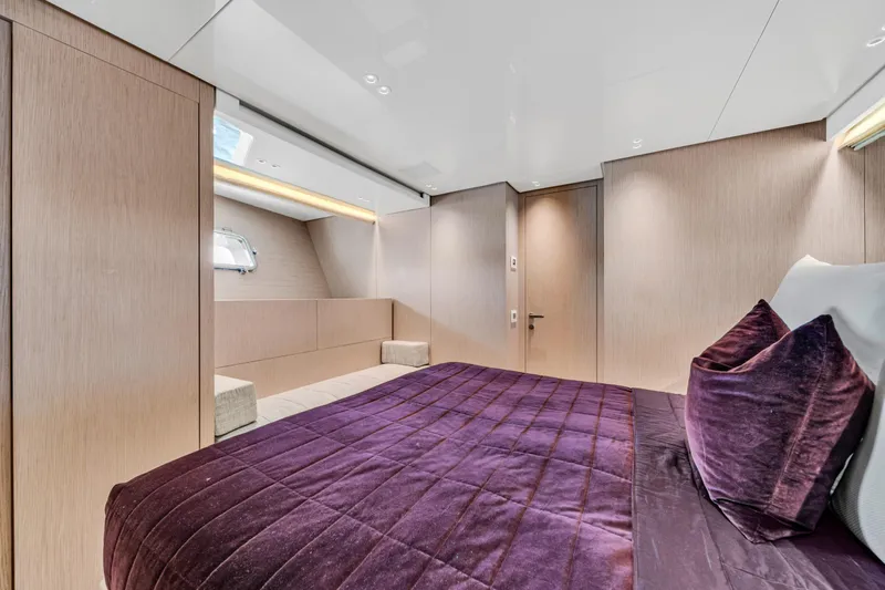 Mave Yacht Photos Pics Luxurious bedroom interior of 2020 Sanlorenzo SX88 yacht with elegant purple bedding.