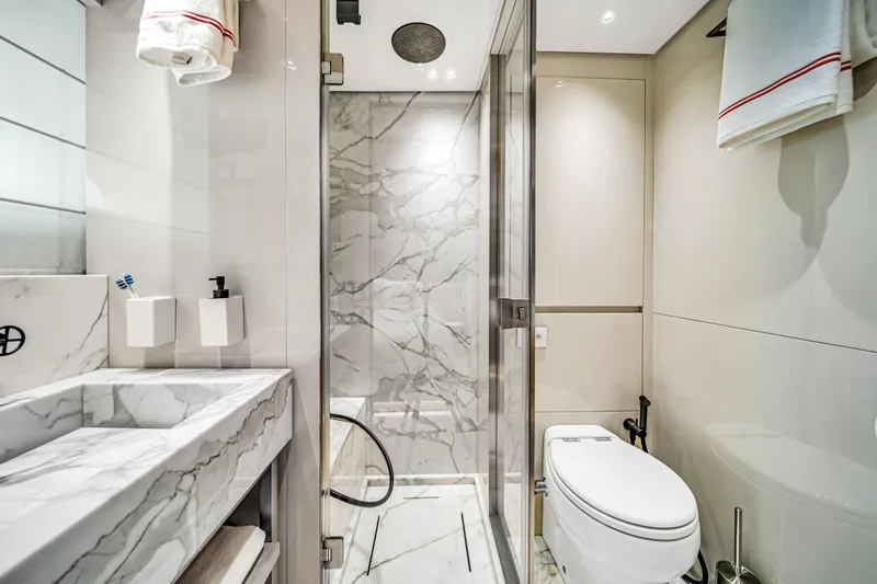 Mave Yacht Photos Pics Luxurious bathroom in 2020 Sanlorenzo SX88 yacht with marble accents and modern fixtures.