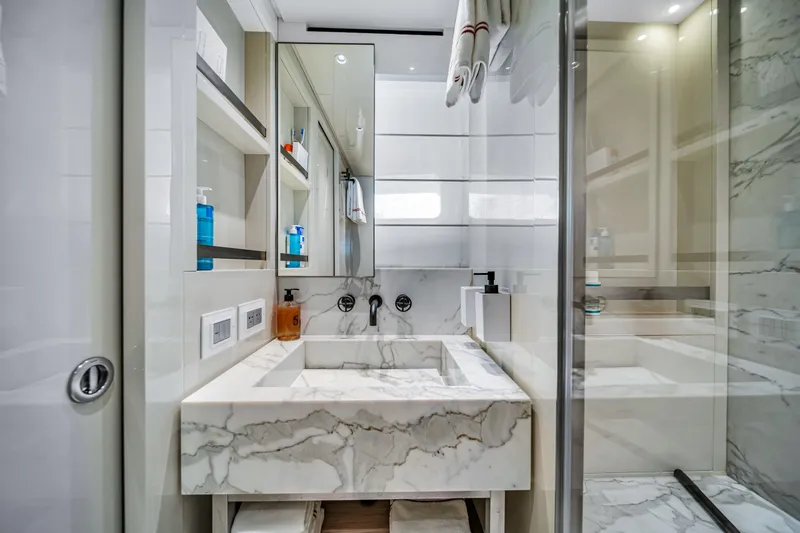 Mave Yacht Photos Pics Luxurious marble bathroom in 2020 Sanlorenzo SX88 yacht, featuring modern fixtures and elegant design.