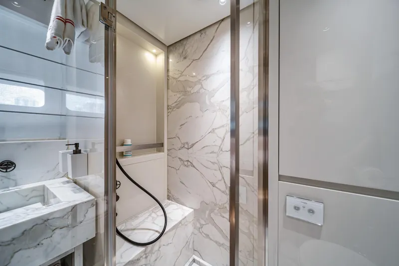 Mave Yacht Photos Pics Luxurious marble bathroom in 2020 Sanlorenzo SX88 yacht, featuring modern fixtures and elegant design.