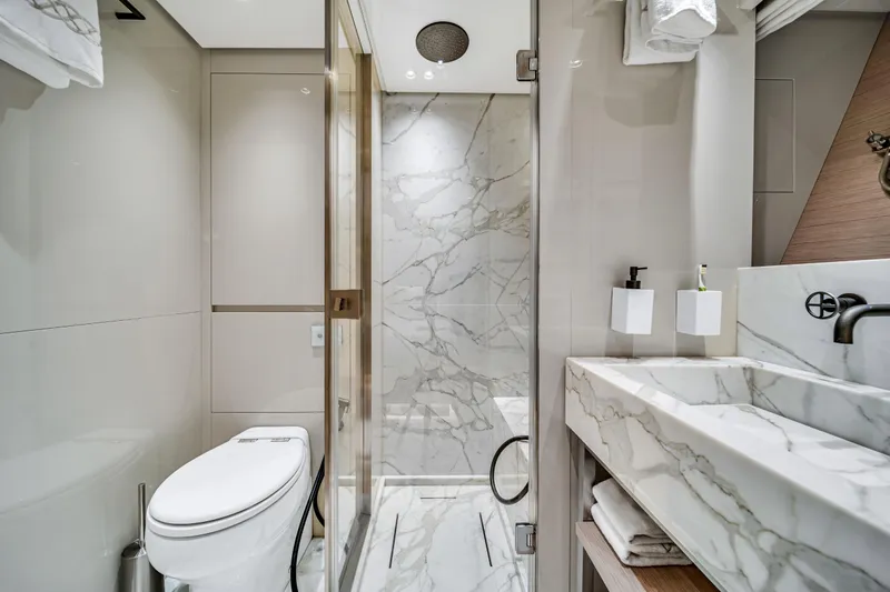 Mave Yacht Photos Pics Luxurious marble bathroom in 2020 Sanlorenzo SX88 yacht, featuring modern fixtures and elegant design.