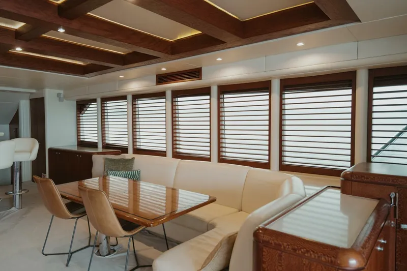 Aussie Rules Yacht Photos Pics Luxurious interior of 1996 Oceanfast 87 Enclosed Bridge yacht with elegant wood accents.