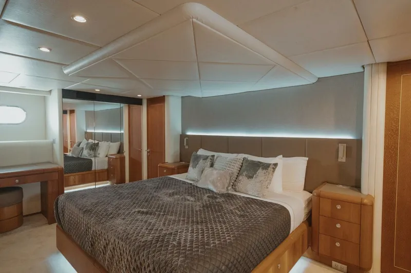 Aussie Rules Yacht Photos Pics Luxurious bedroom interior of 1996 Oceanfast 87 Enclosed Bridge yacht.