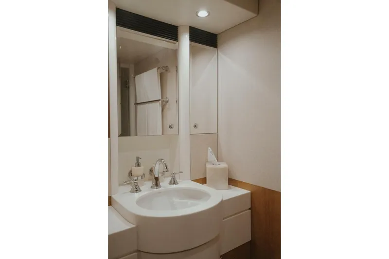 Aussie Rules Yacht Photos Pics Luxurious bathroom in 1996 Oceanfast 87 Enclosed Bridge yacht, featuring modern fixtures and elegant design.