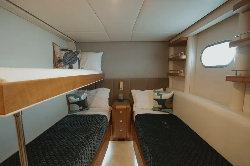 Aussie Rules Yacht Photos Pics Luxurious cabin interior of 1996 Oceanfast 87 Enclosed Bridge yacht with twin beds.