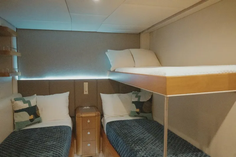 Aussie Rules Yacht Photos Pics Cozy cabin with bunk beds on 1996 Oceanfast 87 Enclosed Bridge yacht.