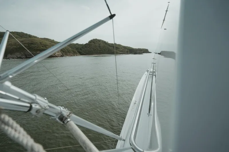 Aussie Rules Yacht Photos Pics Side view of 1996 Oceanfast 87 Enclosed Bridge yacht on calm waters.