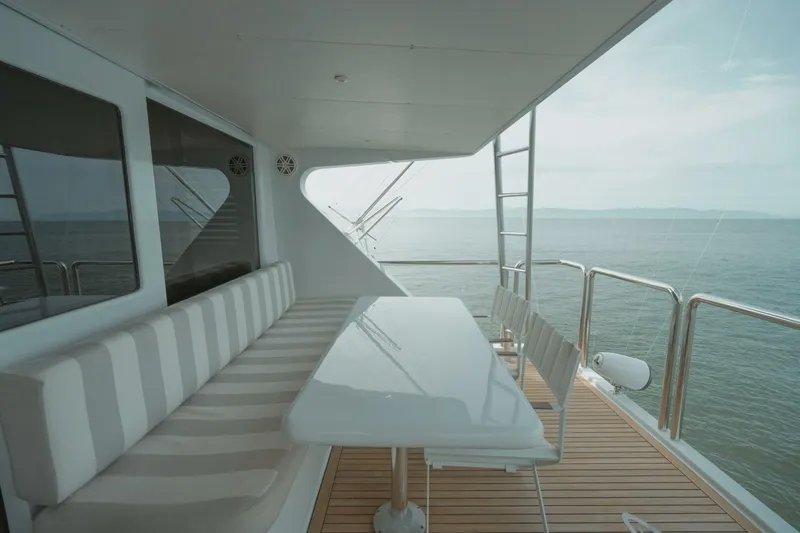 Aussie Rules Yacht Photos Pics Luxurious Oceanfast 87 Enclosed Bridge yacht deck with seating, ocean view, 1996 model.