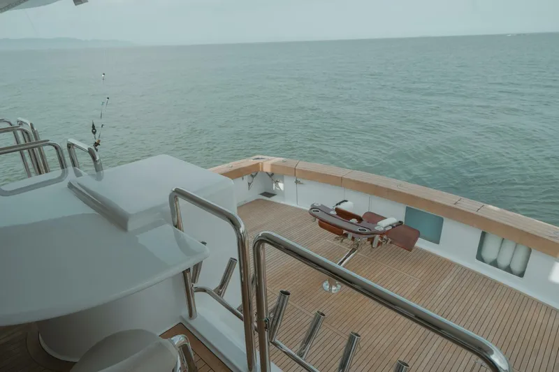 Aussie Rules Yacht Photos Pics Luxurious Oceanfast 87 Enclosed Bridge yacht deck overlooking serene ocean waters, 1996 model.