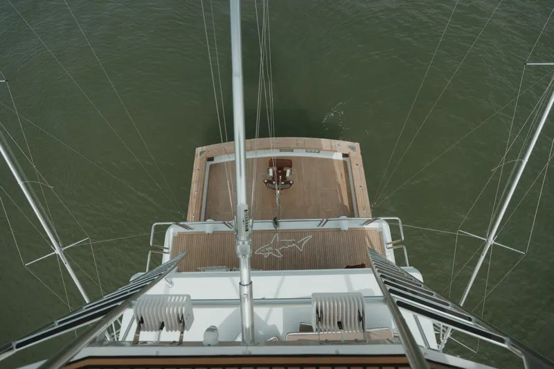 Aussie Rules Yacht Photos Pics Aerial view of 1996 Oceanfast 87 Enclosed Bridge yacht deck over water.