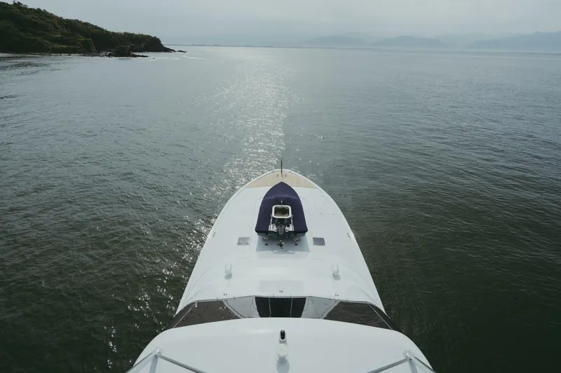 Aussie Rules Yacht Photos Pics Oceanfast 87 Enclosed Bridge yacht cruising on calm waters, 1996 model.