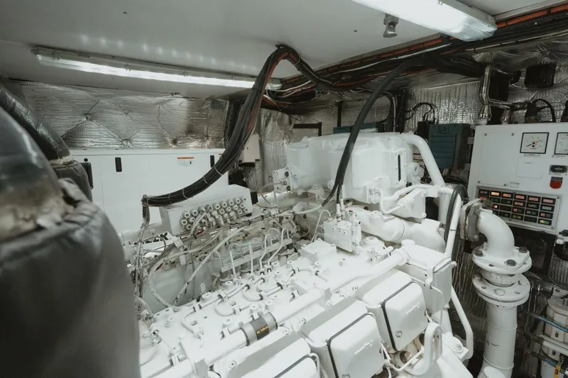 Aussie Rules Yacht Photos Pics Engine room of 1996 Oceanfast 87 Enclosed Bridge yacht, featuring complex machinery and control panels.