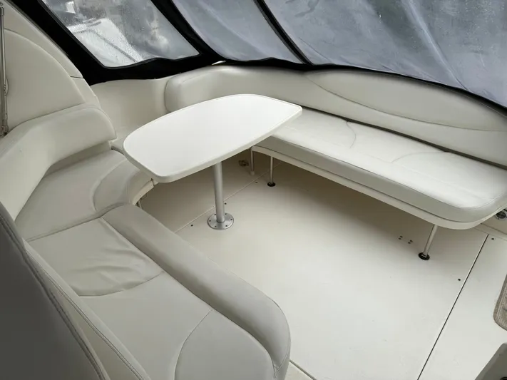  Yacht Photos Pics 2003 Sea Ray 380 Sundancer interior with white leather seating and table.