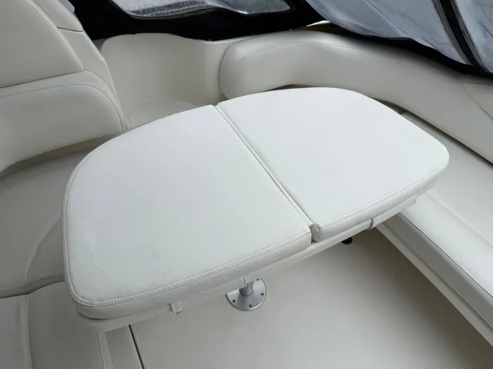  Yacht Photos Pics 2003 Sea Ray 380 Sundancer interior with white cushioned seating and table.