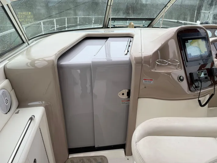  Yacht Photos Pics 2003 Sea Ray 380 Sundancer helm with navigation equipment and seating.