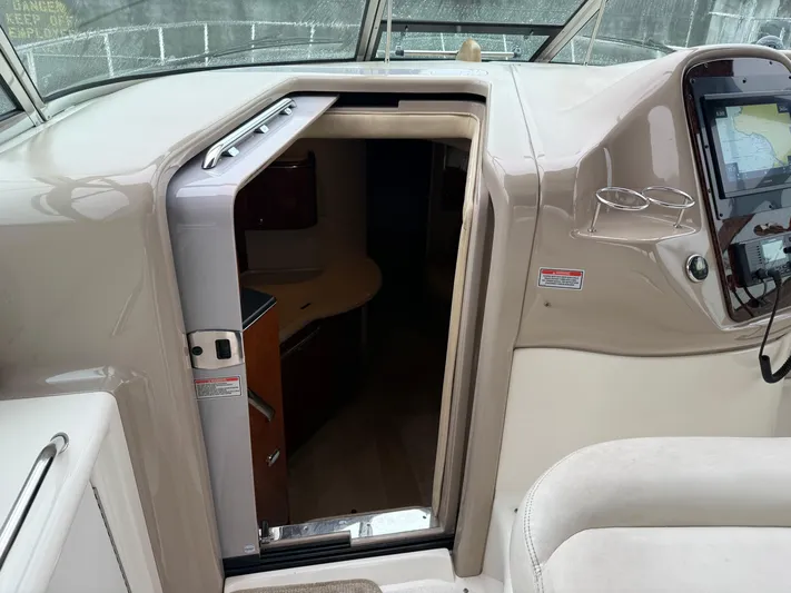  Yacht Photos Pics 2003 Sea Ray 380 Sundancer cabin entrance with dashboard and navigation equipment.