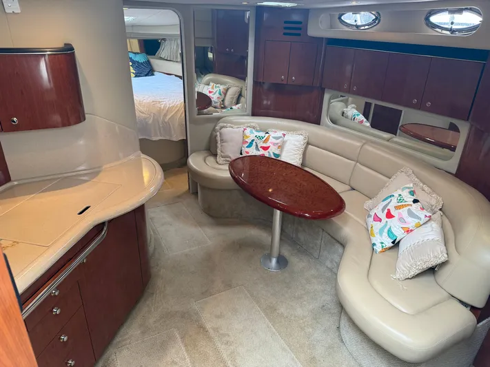  Yacht Photos Pics Luxurious interior of 2003 Sea Ray 380 Sundancer yacht with elegant seating and cabinetry.