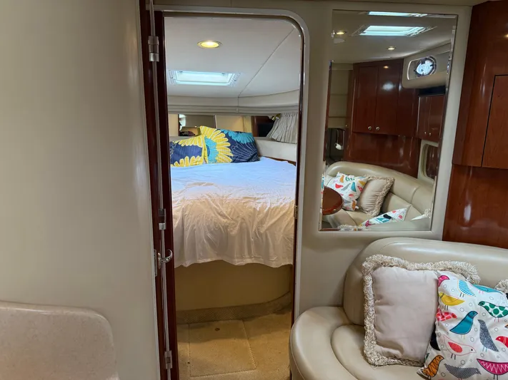  Yacht Photos Pics Interior of 2003 Sea Ray 380 Sundancer with cozy bedroom and seating area.