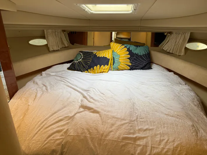  Yacht Photos Pics Cozy cabin interior of 2003 Sea Ray 380 Sundancer with decorative pillows.