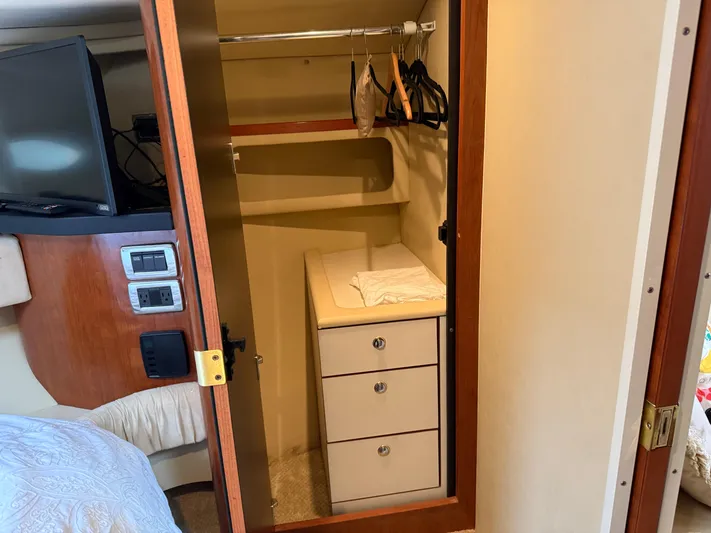  Yacht Photos Pics Closet interior on 2003 Sea Ray 380 Sundancer yacht with drawers and hangers.
