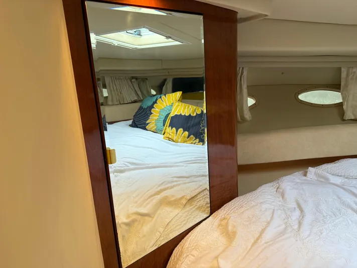  Yacht Photos Pics Interior of 2003 Sea Ray 380 Sundancer with mirror and cozy bedding.