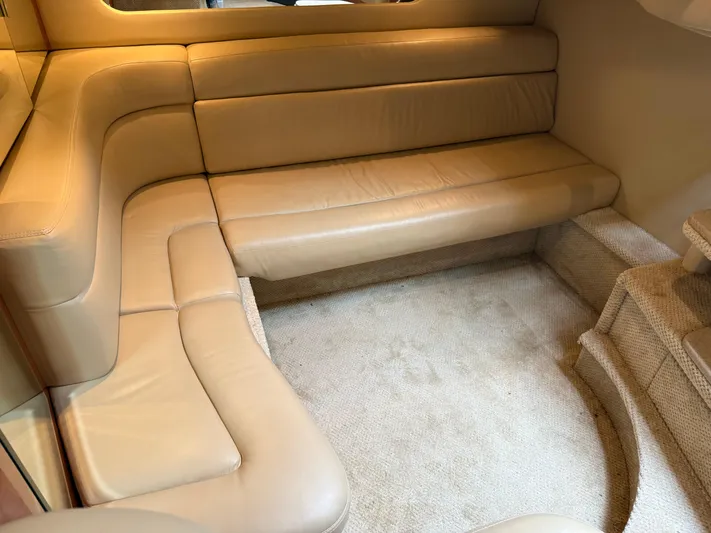  Yacht Photos Pics 2003 Sea Ray 380 Sundancer interior with beige leather seating and carpeted flooring.