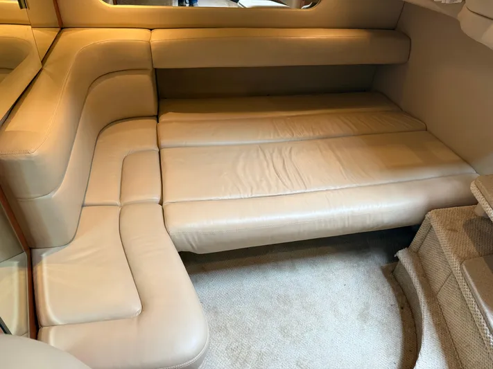  Yacht Photos Pics 2003 Sea Ray 380 Sundancer interior with beige leather seating and carpeted flooring.