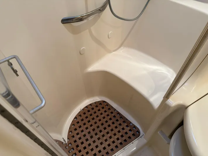  Yacht Photos Pics Shower area in 2003 Sea Ray 380 Sundancer yacht with wooden floor mat.