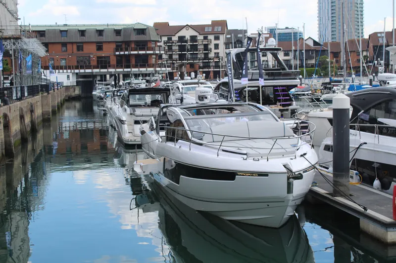 Mby Motor Boat Of The Year 2025 Yacht Photos Pics 2025 Fairline Targa 40 yacht docked in a marina, surrounded by other boats.