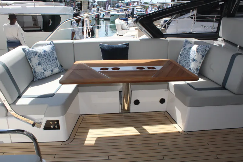 Mby Motor Boat Of The Year 2025 Yacht Photos Pics Luxurious seating area on 2025 Fairline Targa 40 yacht with elegant wooden table.