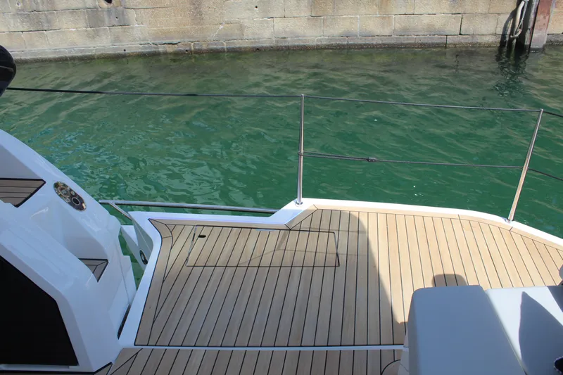 Mby Motor Boat Of The Year 2025 Yacht Photos Pics 2025 Fairline Targa 40 yacht deck with teak flooring by the water.