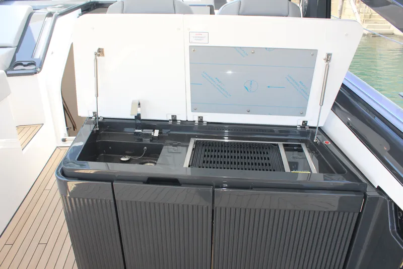 Mby Motor Boat Of The Year 2025 Yacht Photos Pics Outdoor kitchen area on 2025 Fairline Targa 40 yacht with grill and sink.