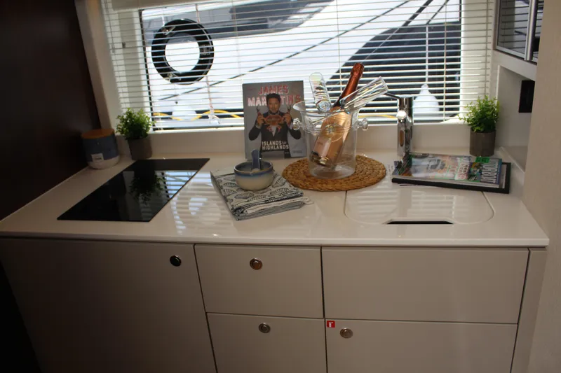 Mby Motor Boat Of The Year 2025 Yacht Photos Pics Modern kitchen interior of 2025 Fairline Targa 40 yacht with sleek design and accessories.