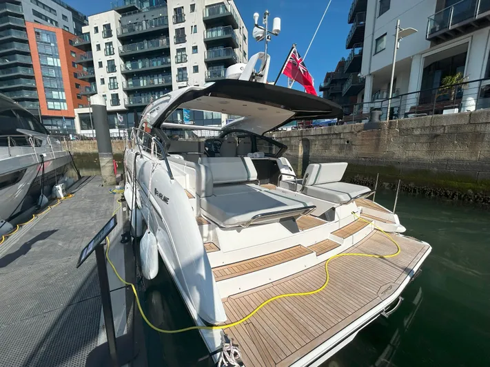 Mby Motor Boat Of The Year 2025 Yacht Photos Pics 2025 Fairline Targa 40 yacht docked at a marina, showcasing sleek design and luxury features.