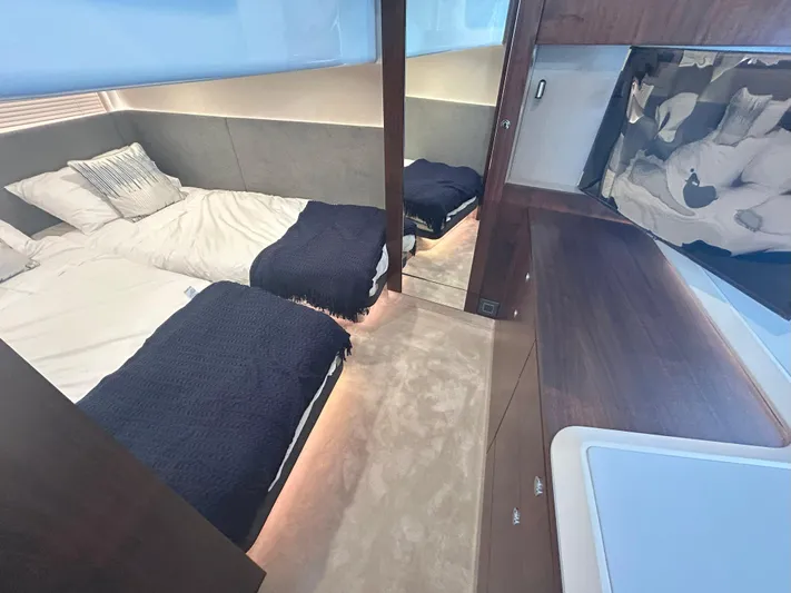 Mby Motor Boat Of The Year 2025 Yacht Photos Pics Luxurious cabin interior of 2025 Fairline Targa 40 yacht with twin beds and modern decor.