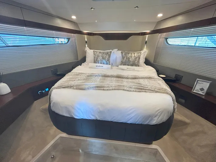 Mby Motor Boat Of The Year 2025 Yacht Photos Pics Luxurious bedroom interior of 2025 Fairline Targa 40 yacht with elegant bedding.