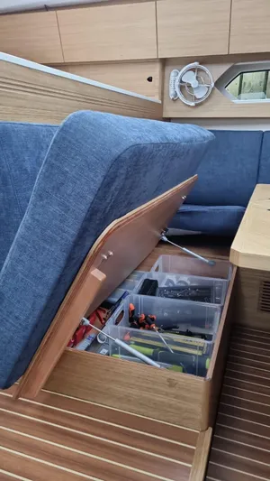 Yula Yacht Photos Pics 2024 X-Yachts Xc 47 interior with storage under blue seating.