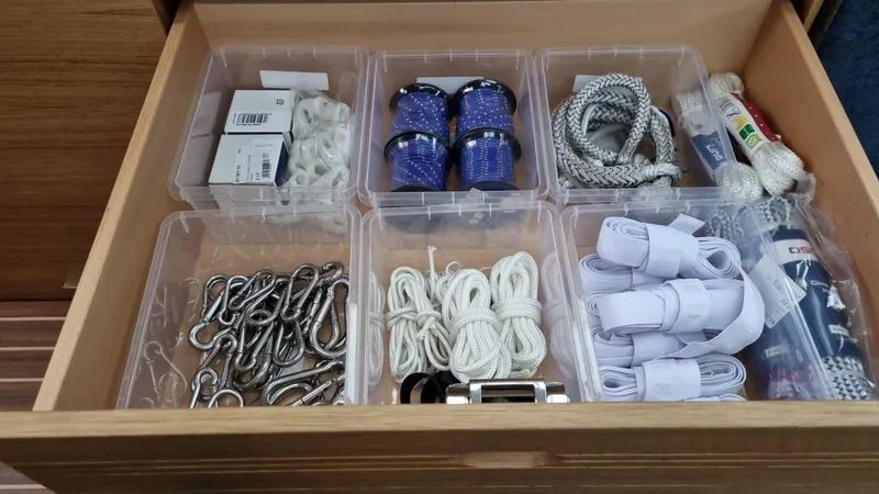 Yula Yacht Photos Pics Drawer with organized sailing gear on 2024 X-Yachts Xc 47, including ropes and hardware.