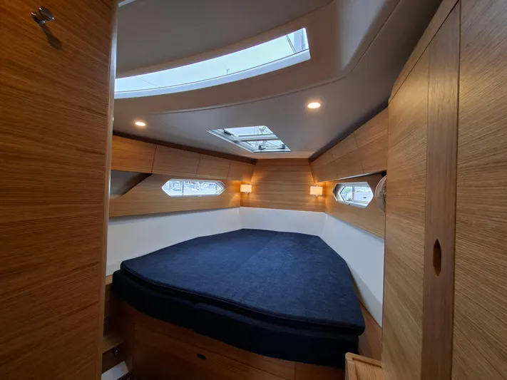Yula Yacht Photos Pics Luxurious cabin interior of 2024 X-Yachts Xc 47 with skylights and wooden finish.