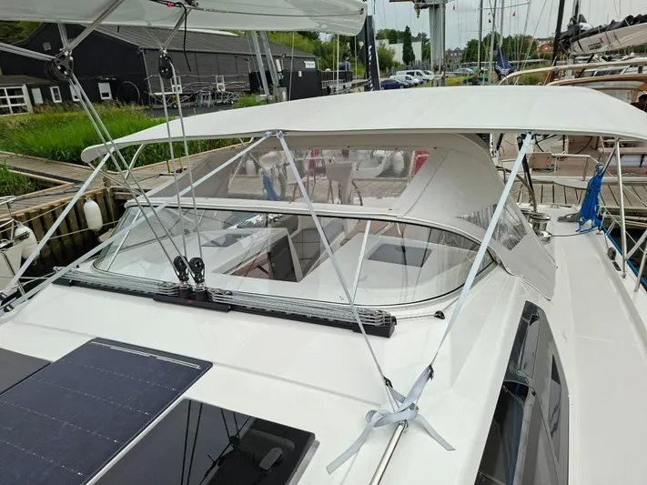 Yula Yacht Photos Pics 2024 X-Yachts Xc 47 sailboat with sleek design and spacious cockpit, docked at marina.