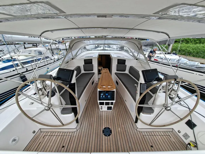 Yula Yacht Photos Pics 2024 X-Yachts Xc 47 sailboat cockpit with dual steering wheels and modern navigation equipment.