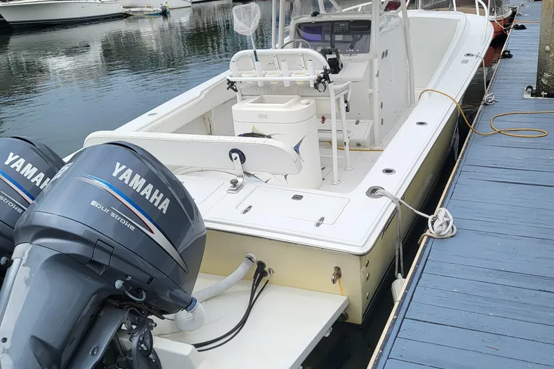 Karan Light Yacht Photos Pics 2004 Jupiter 31 Center Console boat with Yamaha engines at dock.