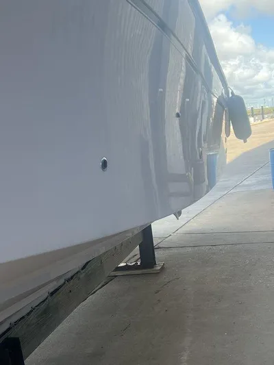  Yacht Photos Pics 2012 Grady-White 336 Canyon boat hull on a stand, side view.