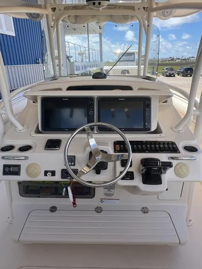  Yacht Photos Pics 2012 Grady-White 336 Canyon boat helm with dual screens and steering wheel.
