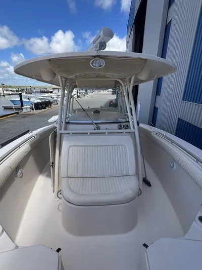  Yacht Photos Pics 2012 Grady-White 336 Canyon boat, spacious deck, marina background, clear sky.