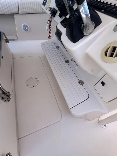  Yacht Photos Pics 2012 Grady-White 336 Canyon boat interior, featuring control panel and seating area.